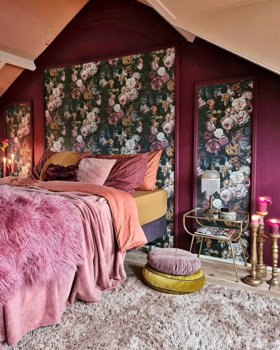 a stylish attic bedroom with floral accents on walls
