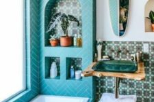 a stylish bathroom with turquoise niche
