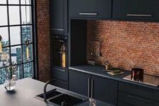 19 a moody and bold kitchen with red brick walls, sleek black cabinetry, black shelves and pendant lamps hanging
