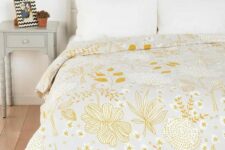 33 a pretty yellow floral and botanical print blanket is all you need to refresh the space for spring