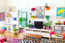35 a colorful maximalist living room with bold layered rugs, pink printed cushions on the floor, some colorful chairs and artworks