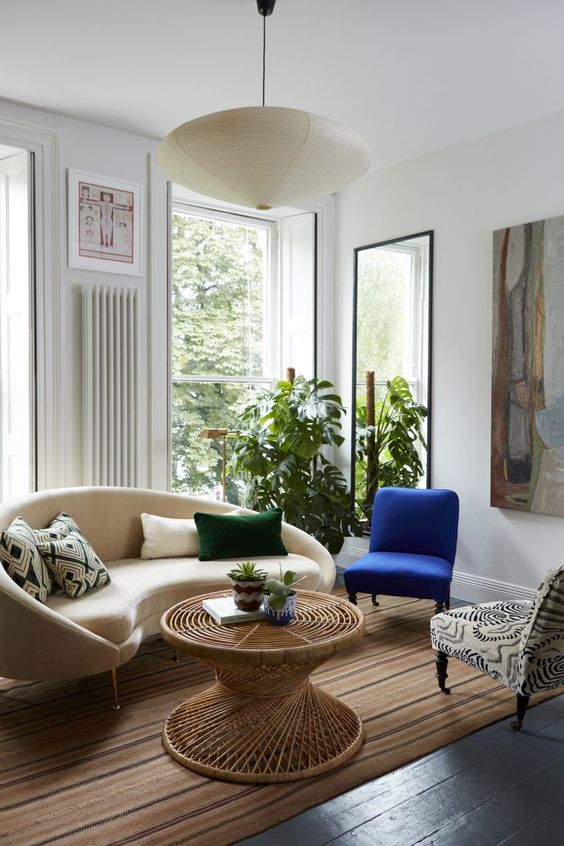 a lovely mismatching chair's mix in a living room