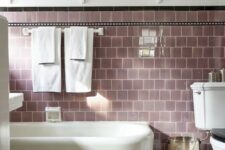 a bathroom with lilac tiles looks very soothing and welcoming, it’s a great color for relaxation