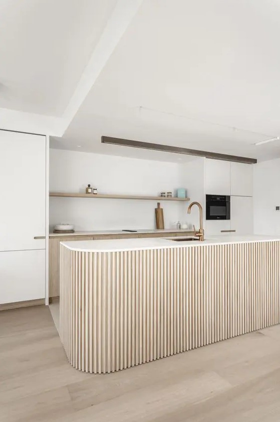 a chic neutral kitchen with stained and creamy cabinets, an open shelf, a curved and ribbed kitchen island