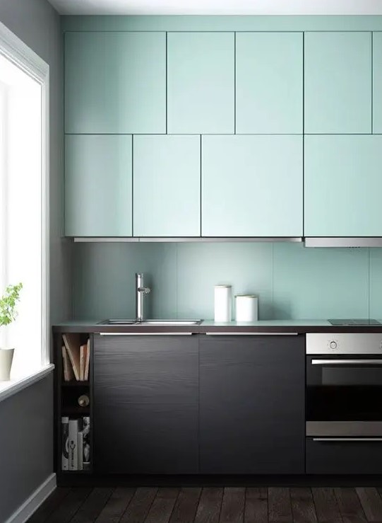 a contemporary dark stained wood and mint kitchen with a mint backsplash looks very contrasting and unusual