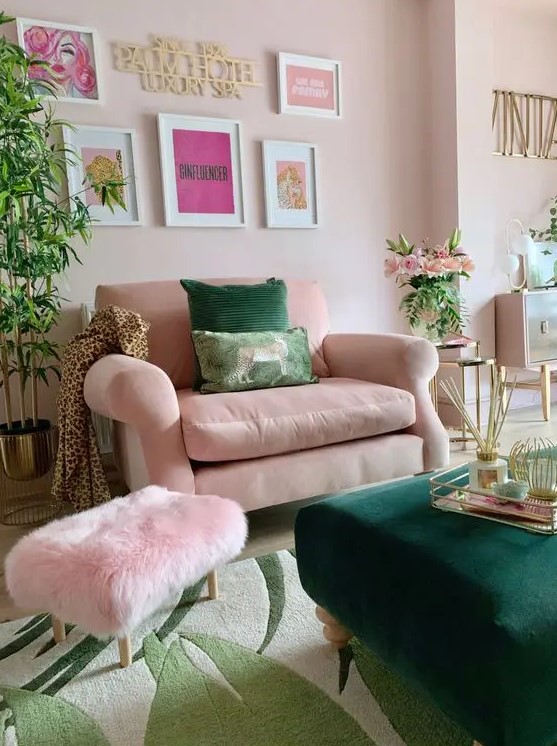 a fab living room with blush walls, a blush chair and a pink pouf, a green ottoman and a gallery wall, potted plants and blooms