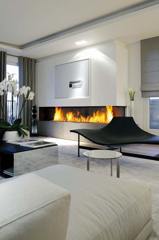 a modern minimalist fireplace fits any contemporary living room