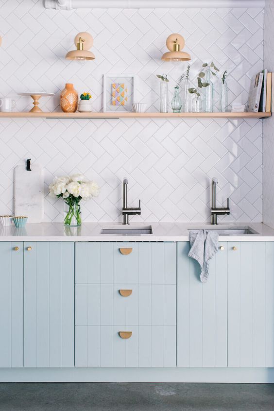 https://www.digsdigs.com/photos/2023/01/a-lovely-kitchen-with-light-blue-kitchen-cabinets-a-white-tile-backsplash-and-white-countertops-an-open-shelf-for-displaying-stuff.jpg