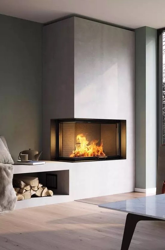 a minimalist built-in fireplace in neutrals with a glass cover and a firewood storage space is a stylish decoration