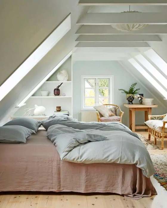 a modern country bedroom with an attic ceiling and wooden beams, skylights, open shelves, wooden furniture and a large bed is very welcoming