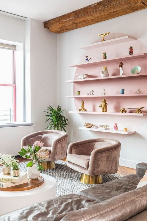  غرف معيشة بألوان الباستيل  A-pastel-living-room-with-a-pink-open-shelving-unit-refined-taupe-furniture-and-potted-blooms-and-greenery