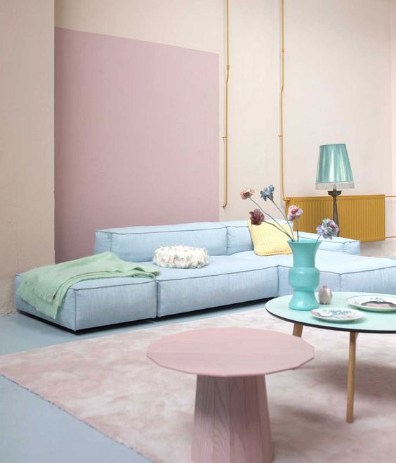  غرف معيشة بألوان الباستيل  A-pastel-living-room-with-blush-walls-a-pink-accent-a-pastel-blue-sofa-pastel-side-tables-and-a-blue-lamp