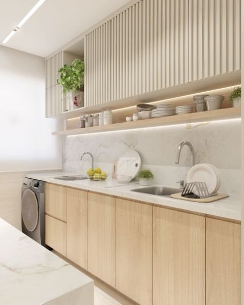 a small neutral kitchen with light stained and white ridged cabinets, a long open shelf and built in lights plus greenery
