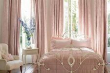 a vintage feminine bedroom with elegant white furniture, pink linens and textiles and nothing else is beautiful