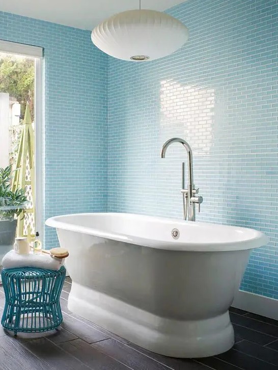 light blue tiles on the walls and a matching wire stool plus whites for a relaxing ambience