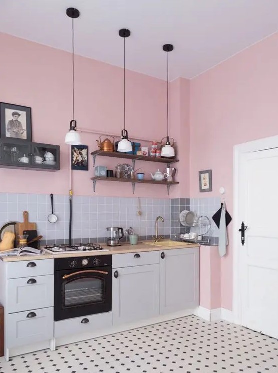pink walls and shades of grey are a perfect combo for any kitchen and black touches add depth