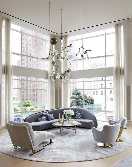 a couple of floor to ceiling windows fill the space with light and helps to highlight the double height of the ceiling