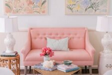 26 a beautiful and sweet pastel living room with a pastel pink sofa and pale blue chairs, pastel floral artworks and a rug plus chic side tables