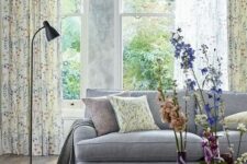32 a light and airy spring living room with a grey sofa, floral curtains and fresh blooms in colorful vases is very cool