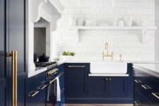 45 an elegant navy kitchen with shaker cabinets, white stone countertops, a large kitchen island, a white square tile backsplash and a white shelf for dishes