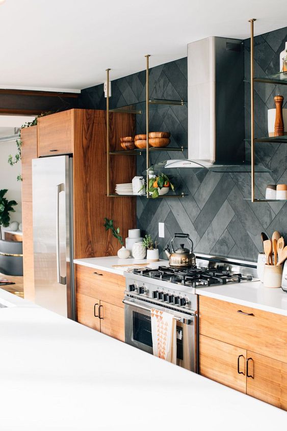 a modern rustic kitchen with stained flat panel cabinets, white stone countertops, a herringbone tile backsplash, suspended open shelves
