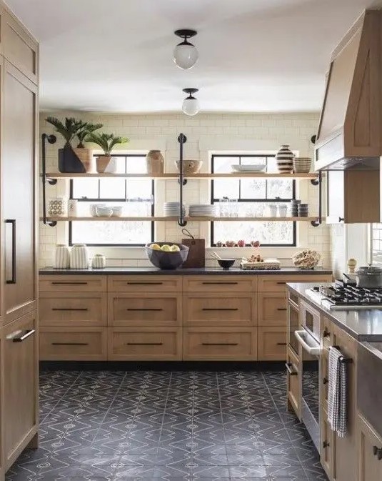 a stained kitchen with shaker style cabinets, black stone countertops and black handles, long open shelves instead of upper cabinets is cool