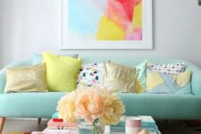 50 a mint sofa is a soft base for adding bright colors with the rug and the artwork for a cheerful feel