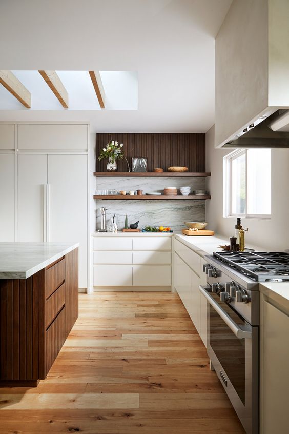 a contemporary kitchen sleek flat panel white cabinets, open shelves, a dark-stained kitchen island and white stone countertops