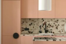 a cool modern pink kitchen with a bold terrazzo backsplash and countertops is a lovely and bold space that inspires