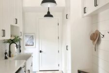 a practical entryway design with a hidden washing machine