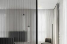 a fluted glass space divider is a beautiful idea for a refined space, it brings ultimate elegance and separates the spaces