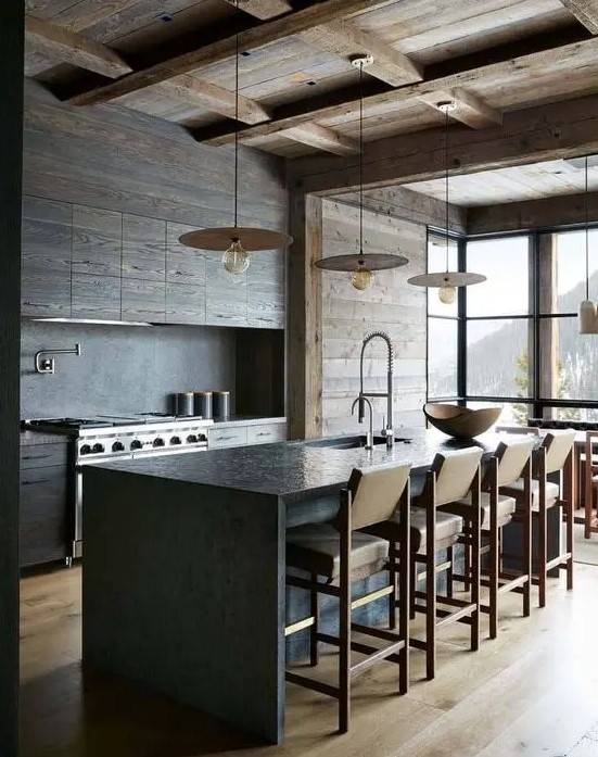 a minimalist chalet kitchen with sleek wooden cabinets and a wooden ceiling and walls, a stone kitchen island and leather chairs