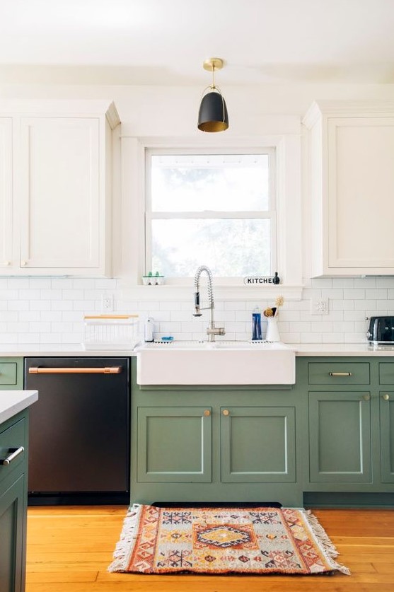 a modern kitchen with white and sage green cabinets, touches of gold and copper and a boho printed rug