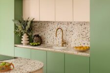 a lovely pastel green kitchen design