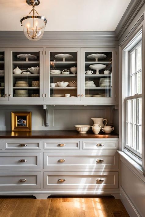 a refined dove grey kitchen with vintage flare, with inlay and glass front cabinets, a matching wooden backsplash and butcherblock countertops