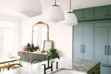 a slate grey kitchen with flat panel cabinets, a stained kitchen island with a black terrazzo countetop and black fixtures