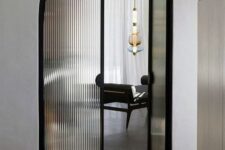 beautiful black frame arched fluted glass doors will instantly elevate the space to a new level and will highlight its refined look