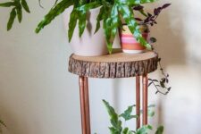 02 a cool plant stand of tree slices and copper pipes is great for a mid-century modern or rustic interior, it can be DIYed