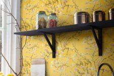 a yellow backsplash is an awesome addition to a black kitchen