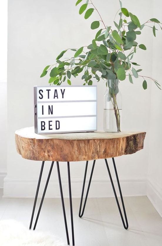 a cool tree slice side table on hairpin legs can be DIYed to add interest and coziness to your space