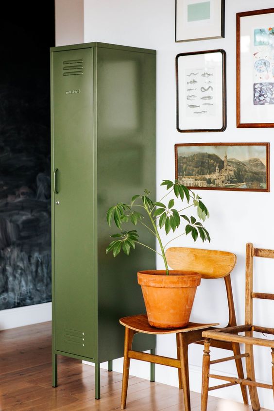a skinny green locker looks very delicate and provides a lot of storage space, and its color perfectly matches many spaces