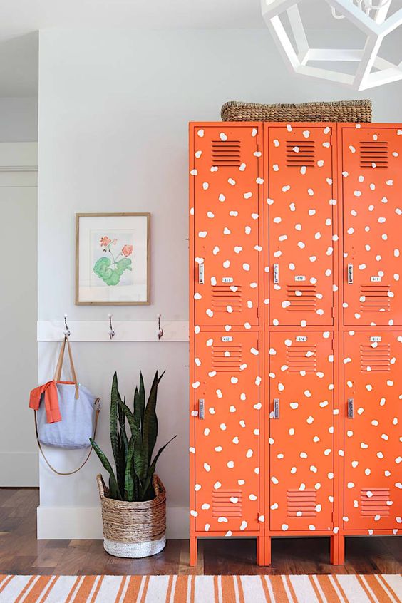 super bold orange lockers featuring a fun print will add a touch of whimsy to the space and will bring color to it, perfect for a kids' room