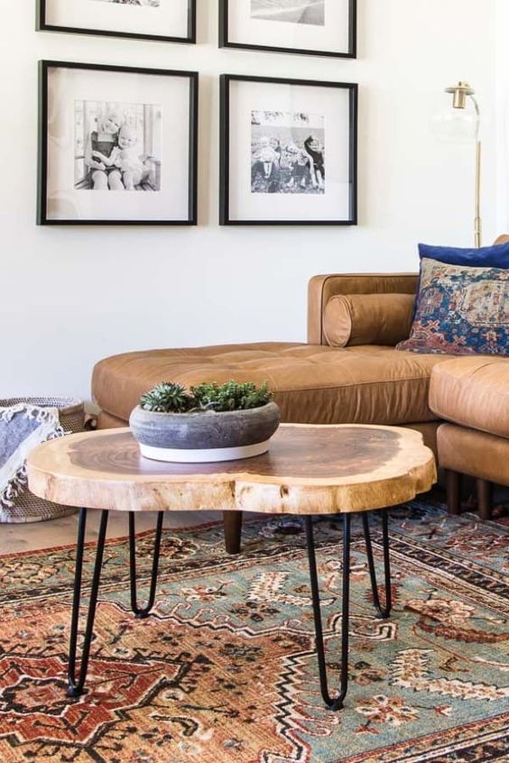 a lovely tree slice hairpin leg coffee table with a laminated surface is a stylish addition to a mid-century modern living room