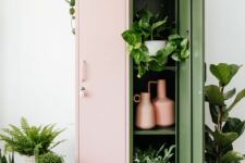 10 a pink and green locker as a plant stand and a storage unit, with lots of greenery inside, on top and around it