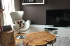 12 a pretty tree slice coffee table on hairpin legs is a cool rustic piece that can be added to a mid-century modern space