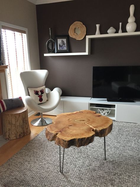a pretty tree slice coffee table on hairpin legs is a cool rustic piece that can be added to a mid-century modern space