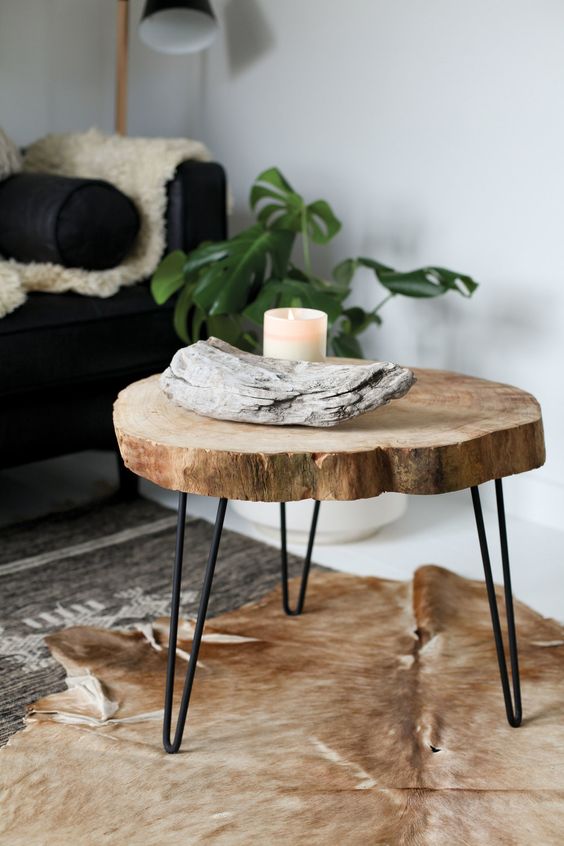 a rustic side table of a tree slice and black hairpin legs is a lovely rustic piece or a plant stand if you need one