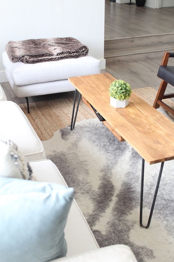 a cool and functional hairpin leg coffee table with an additional hidden shelf is a perfect solution for a boho or mid-century modern space