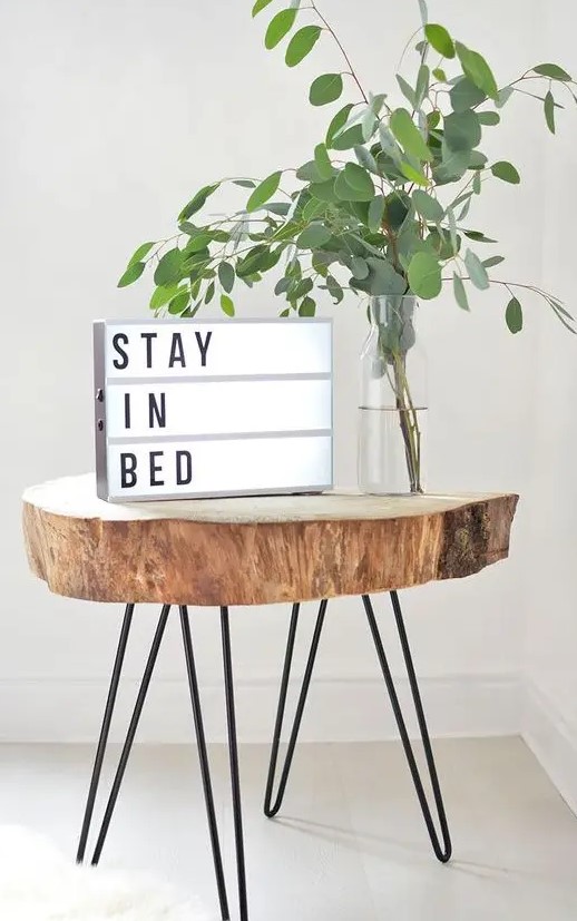 a cool tree slice side table on hairpin legs can be DIYed to add interest and coziness to your space