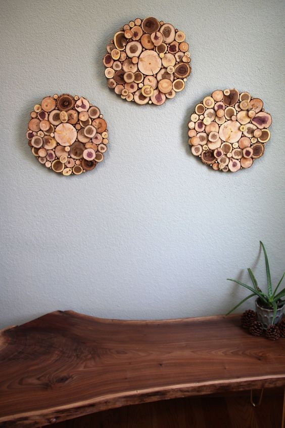a cool wall art of three circles composed of tree slices is a lovely rustic decor idea for a farmhouse or rustic space